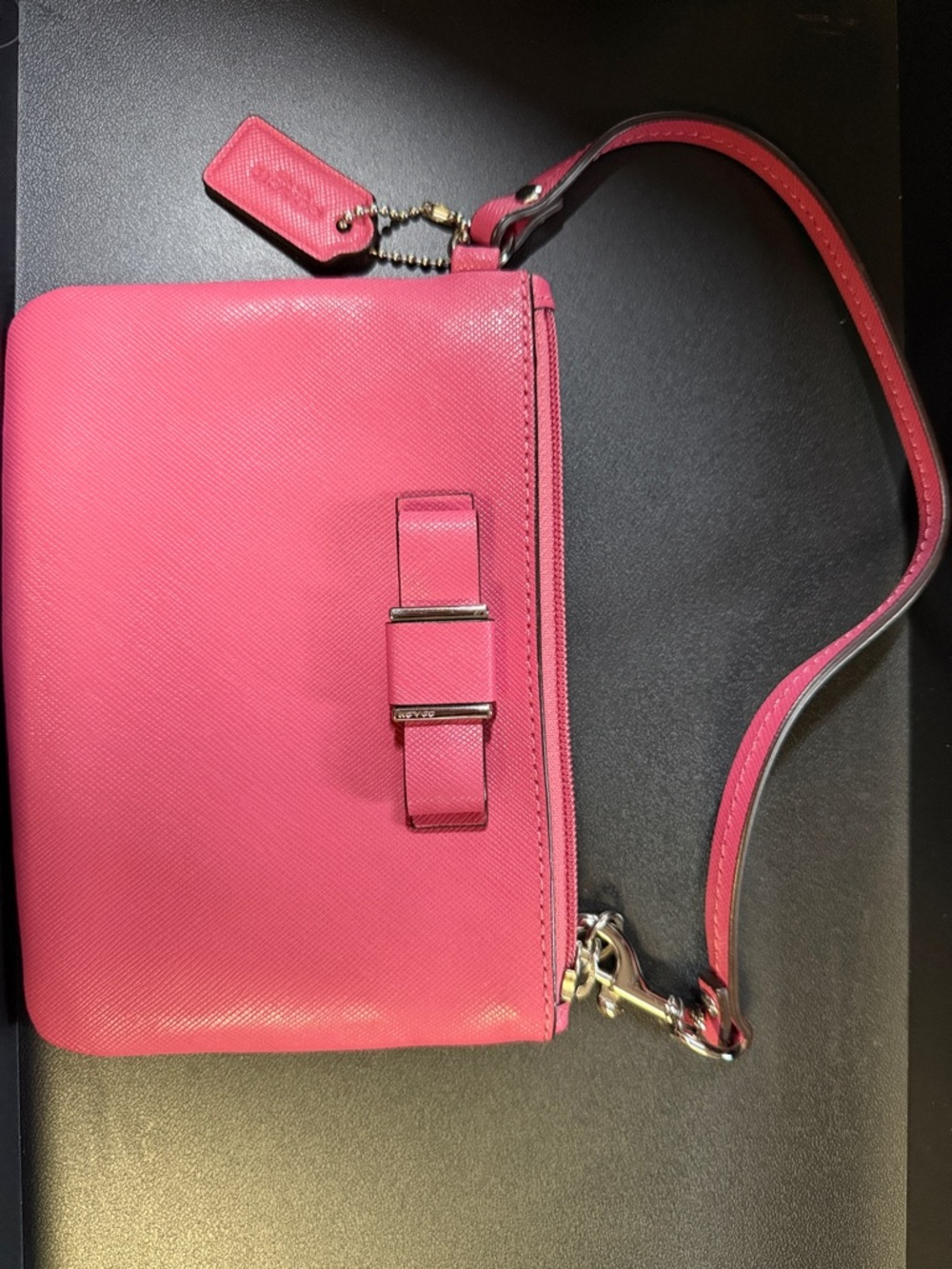 Coach Darcy Bow Strawberry Pink Saffiano leather wristlet.